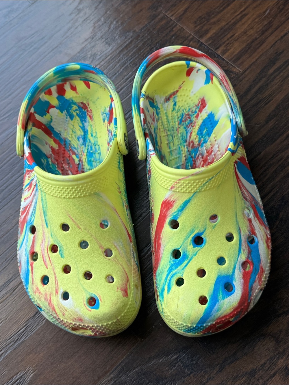 CROCS Yellow Tie-Dye Sandals with Red & Blue Swirls